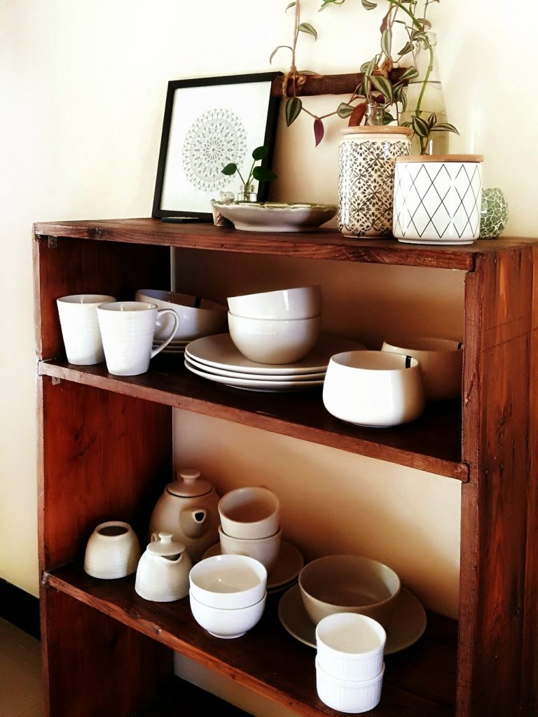 Jayati and Manali share their home tour as the science home décor - the corner of the room decorated with ceramic tea set, bowl, mandala frame and indoor plant