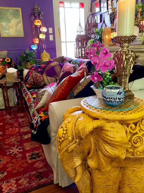 Different colours and textures of cushions and yellow elephant table at the corner of the living room | Martine's boho chic abode in Australia