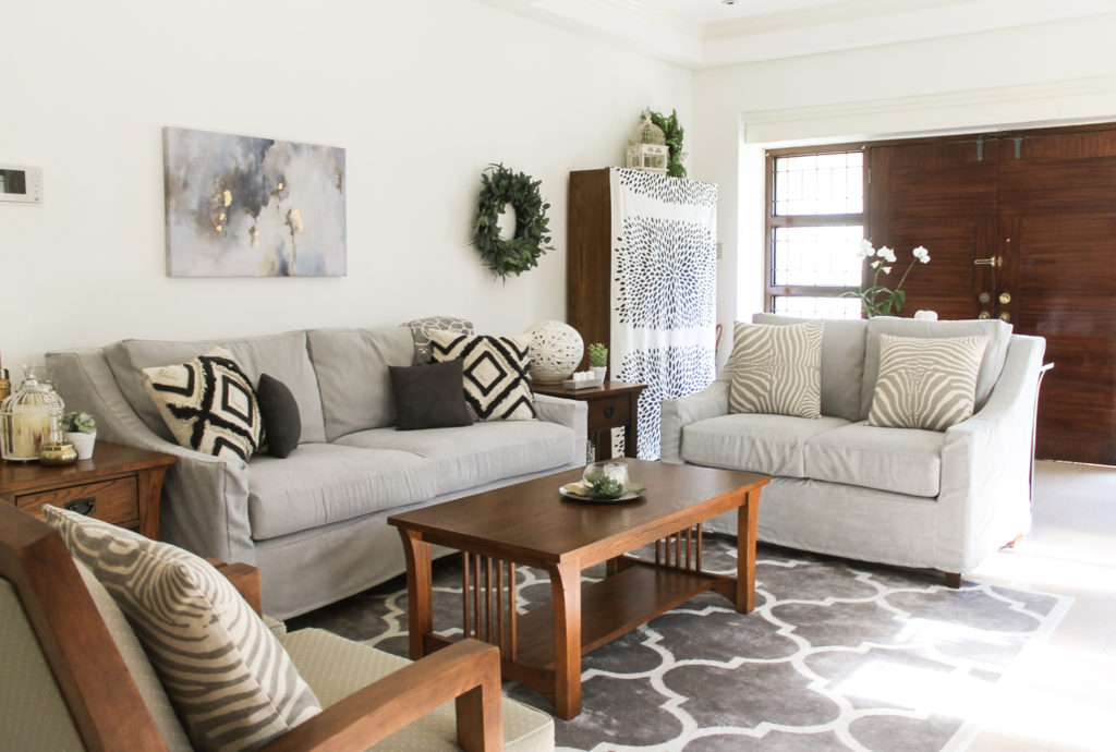 Home Tour with Kaho of Chuzai Living - the living room filled with wreath, painting frame on wall, and beautiful cushion cover