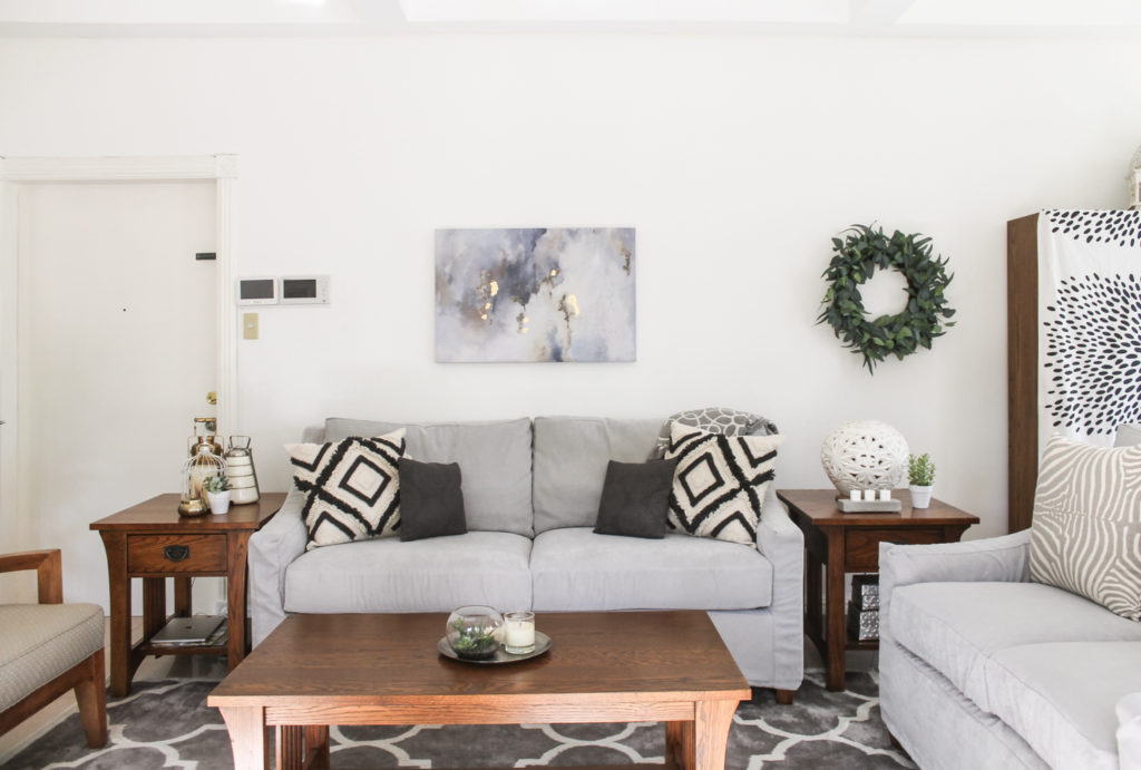 Home Tour with Kaho of Chuzai Living - the living room filled with wreath, painting frame on wall, and beautiful cushion cover