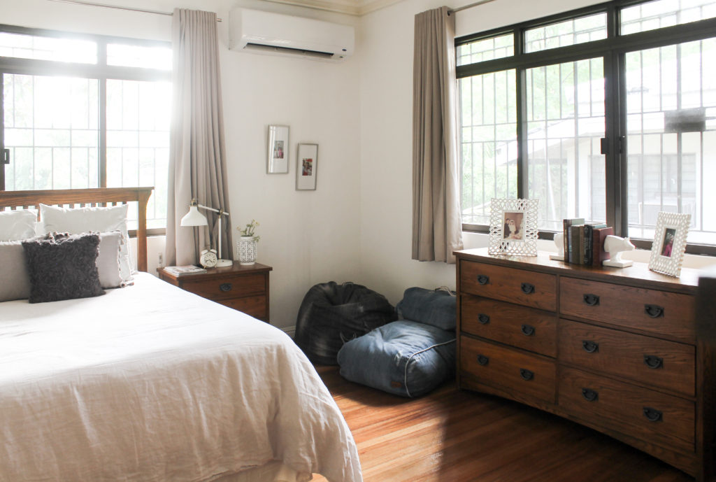 Home Tour with Kaho of Chuzai Living - the master bedroom filled with beanbag chair, desk chest, photo frames, lamps and books