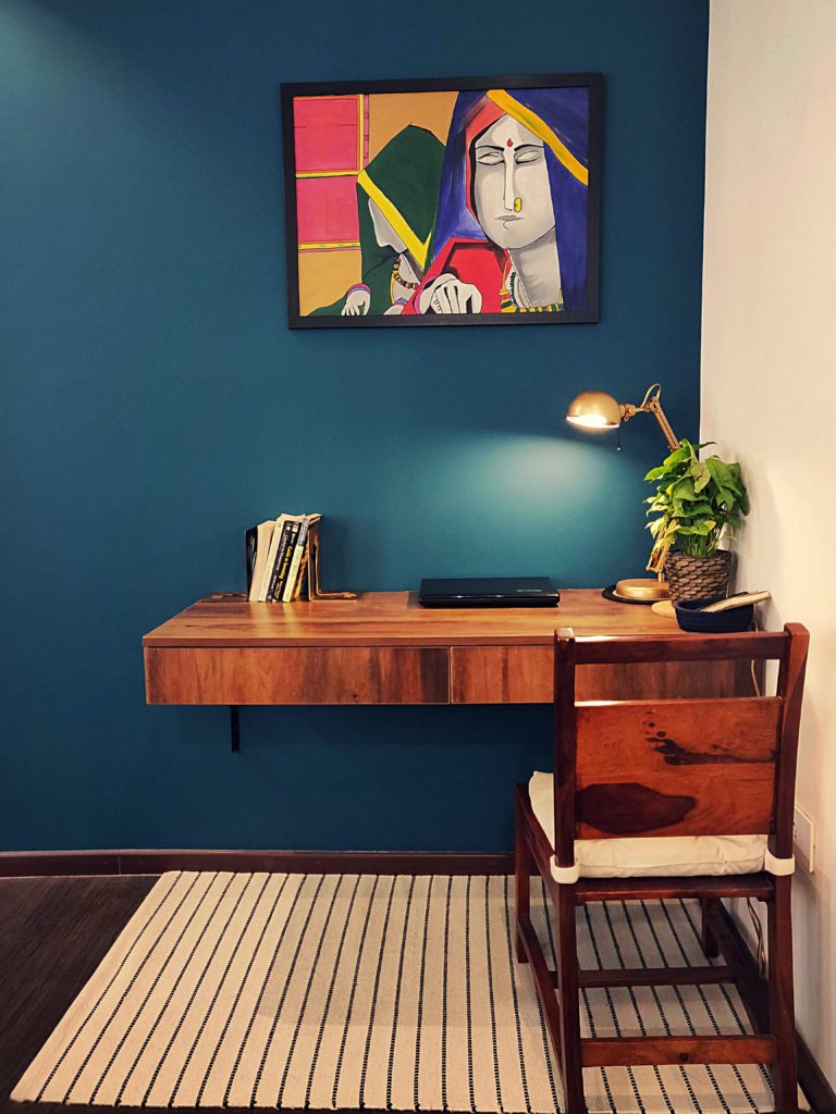 Home style Tour with Rajni in Hyderabad: handpainted frame, table lamp, green plants and books on the study desk