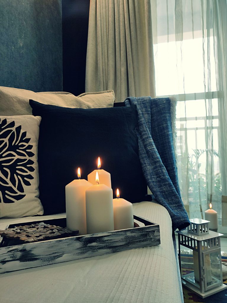 Home style Tour with Rajni in Hyderabad: the collection of candles and the beautiful cushion cover makes the room perfect