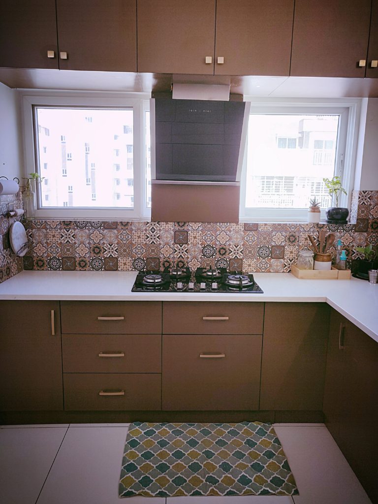 Home style Tour with Rajni in Hyderabad: The tiles used for backsplash are Morrocan to add an element of interest in a brown and beige kitchen