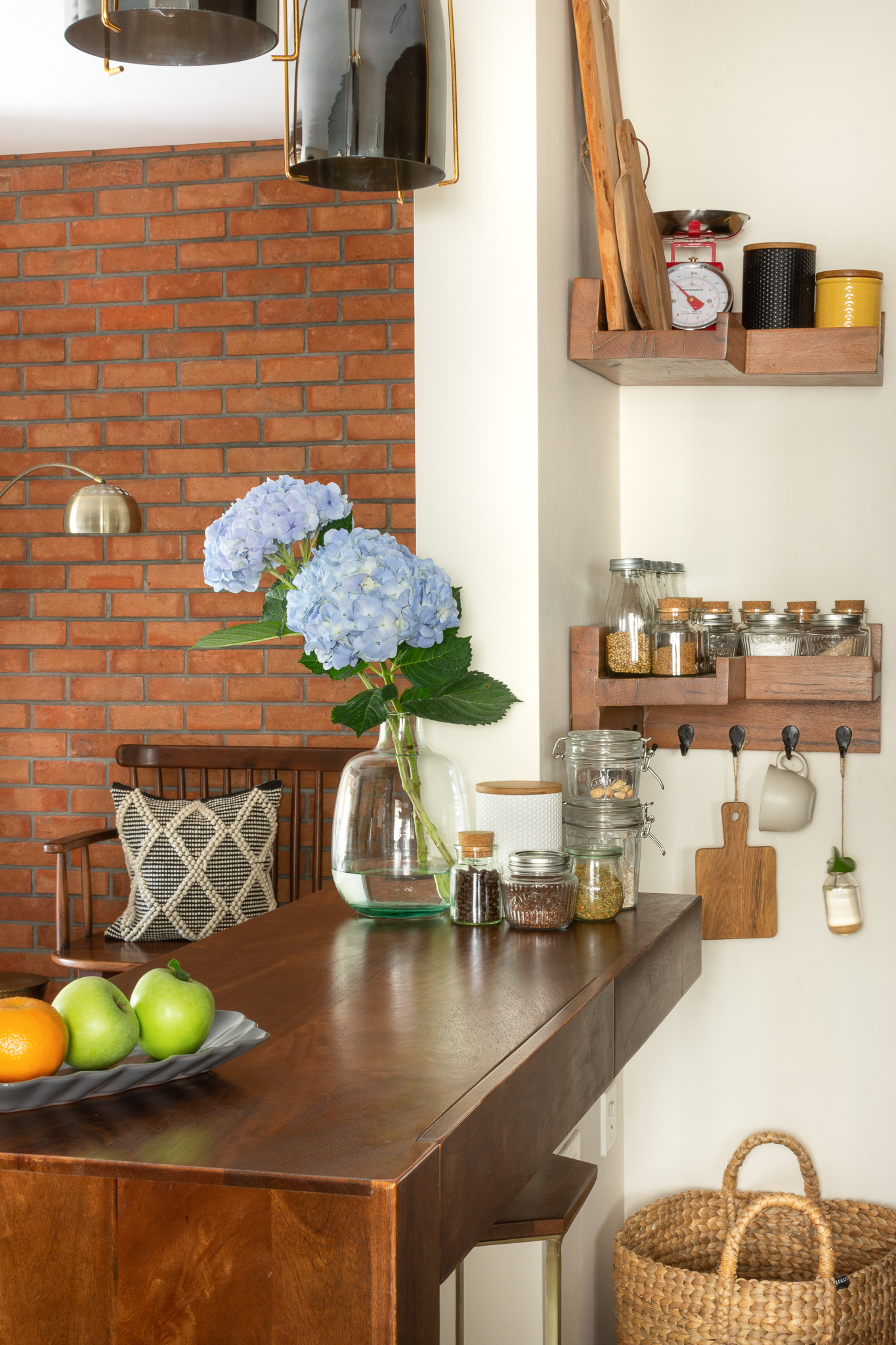 Neat and clean kitchen corner spice shelves with breakfast counter | Nehal's Bengaluru Styling Apartment