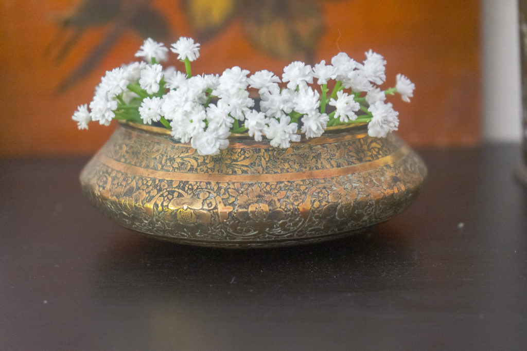 Affinity for antiques and collection of vintage | Home tour of Rushika & Dipkal's - brass bowl with flower on it