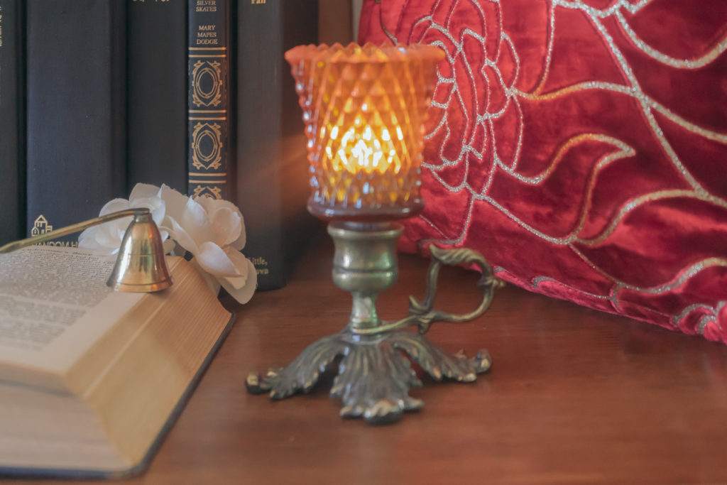 Affinity for antiques and collection of vintage | Home tour of Rushika & Dipkal's - the collection of brass lantern and books at the corner of the room