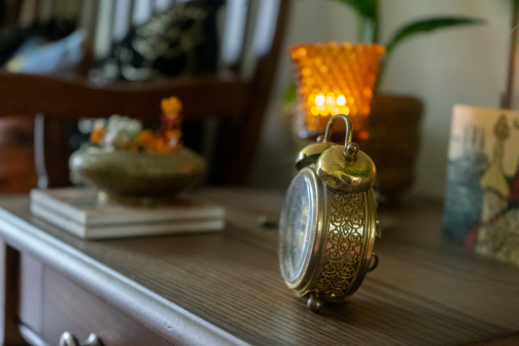 Affinity for antiques and collection of vintage | Home tour of Rushika & Dipkal's - the antique clock at the corner of the room