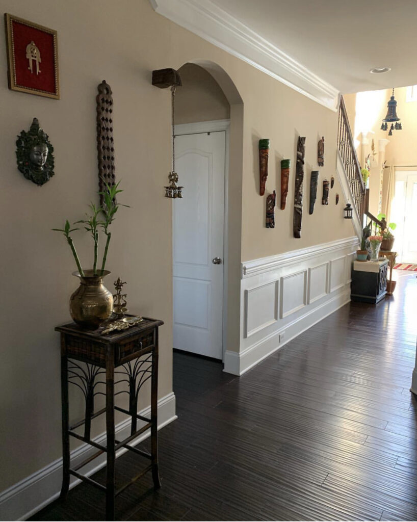 The home is filled with brass idols and mask collection