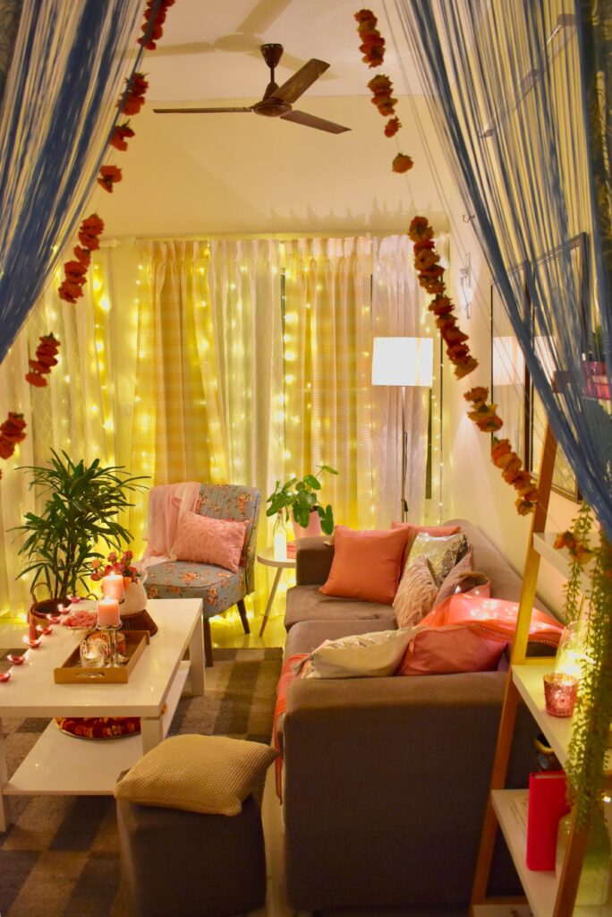In this Diwali the living room is decorated with embracing Pink and Peach pastel pellet with a tinge of gold and silver