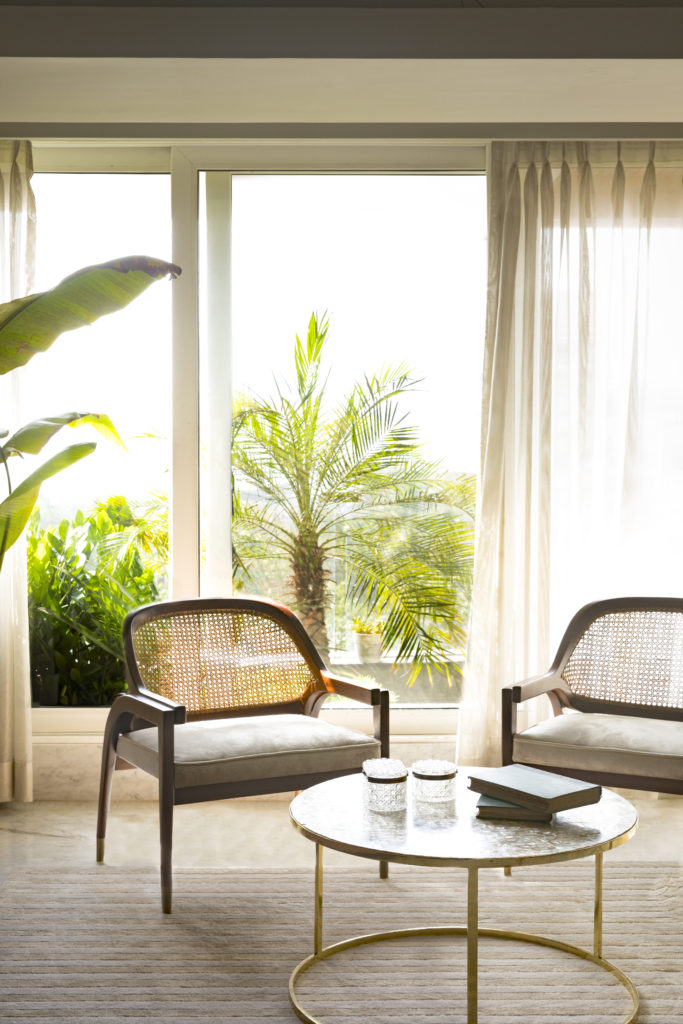 Home Renovation Story | Mohamedi & Durriya Sham's Aesthetic Mumbai Home - tall tropical plants for the outside balcony