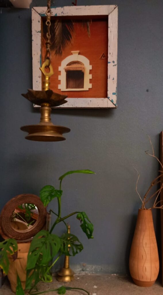 Antique brass diya and green plant at the corner of the room | Leesha's Pune home tour | Thekeybunch