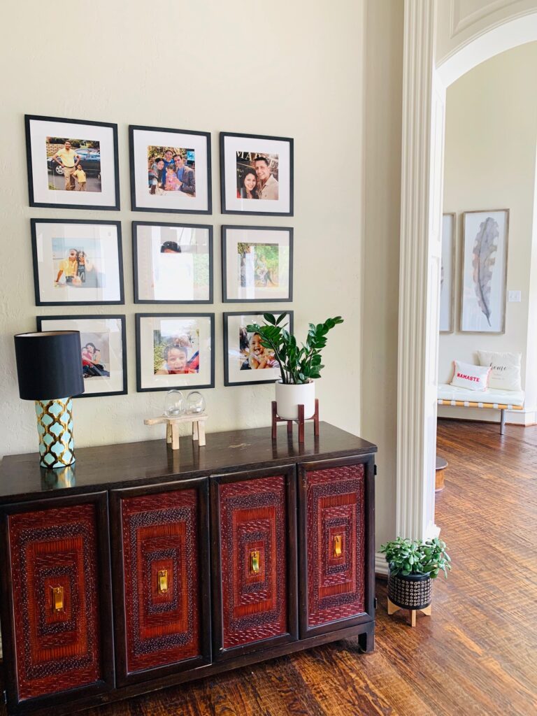 the wall gallery, green plants and chest drawer at the corner of the room | Ruma's Indian Home in Texas | theKeybunch decor blog