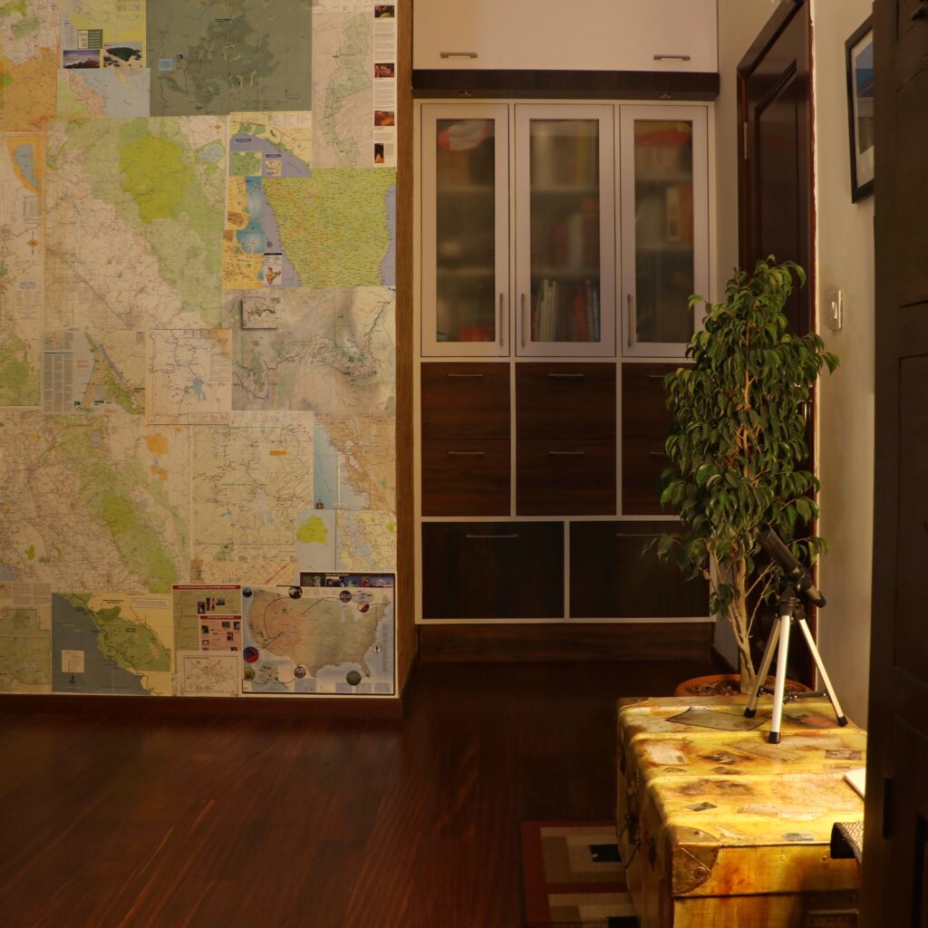 The map wallpaper at the nook behind the door in the study room | Home Tour: A beautiful Antique Modern home in Bangalore