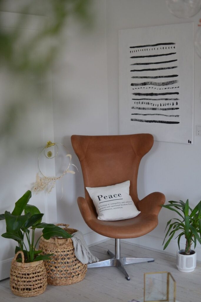 The chair and the basket planters at the corner of the room | Naina's Scandi-Minimalist Home with Indian Accents