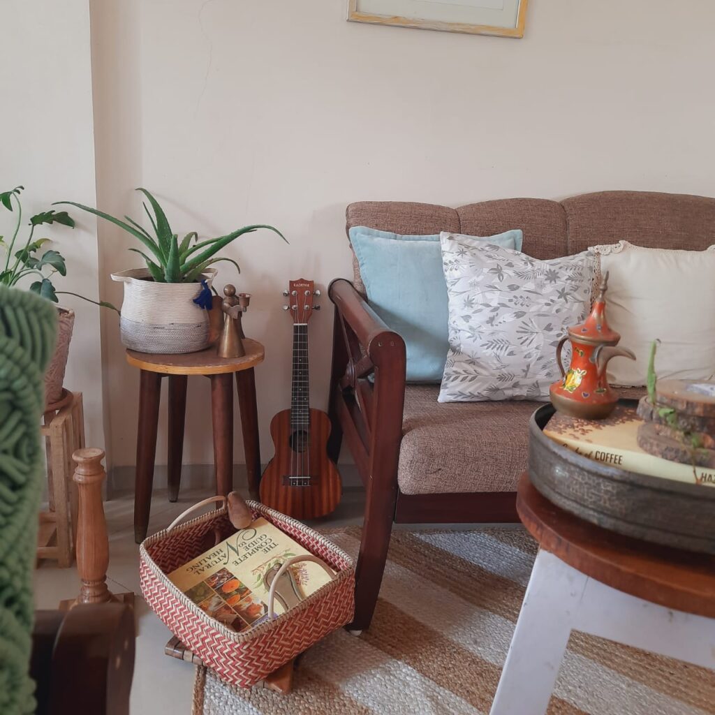 a basket filled with books at the living room | A case for Baskets | TheKeybunch decor blog