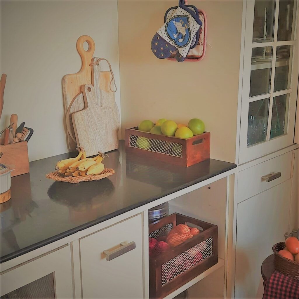 Decorate with a touch of yellow during the pandemic | The bananas on this kitchen counter add a small touch of yellow, as do the mosambis in the basket