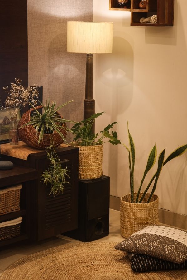The two rivergrass baskets and a floor lamp made out of shell casings | Home Tour: A beautiful Antique Modern home in Bangalore