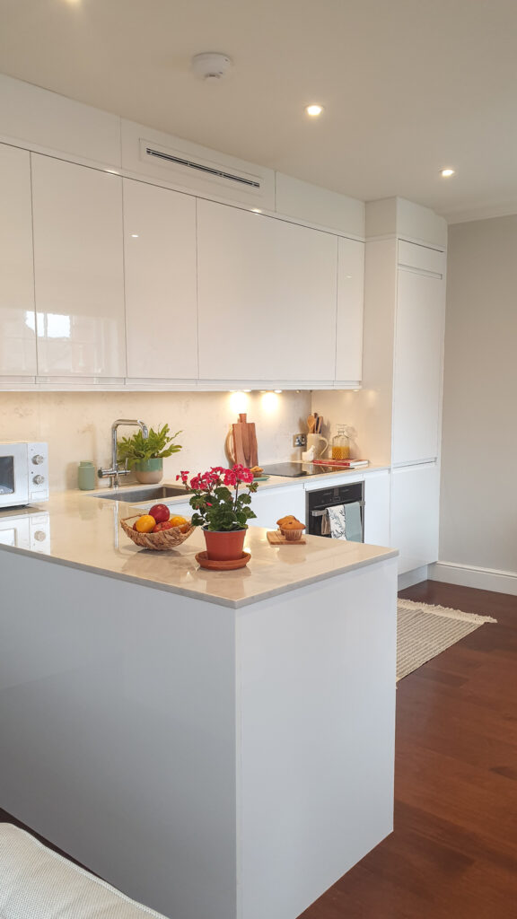 The white countertop and cabinets blend seamlessly offering a streamlined, unfussy look | Shilpee's Home with Gorgeous White Pallette