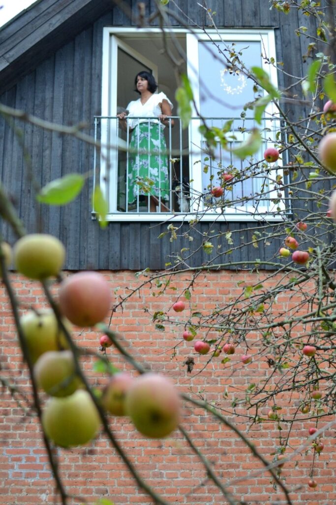 The beautiful shot of Naina and apple trees from her garden | Naina's Scandi-Minimalist Home with Indian Accents