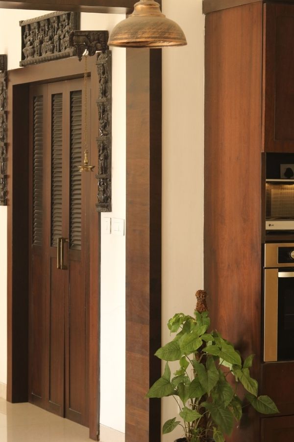 A vintage teak door | Home Tour: A beautiful Antique Modern home in Bangalore