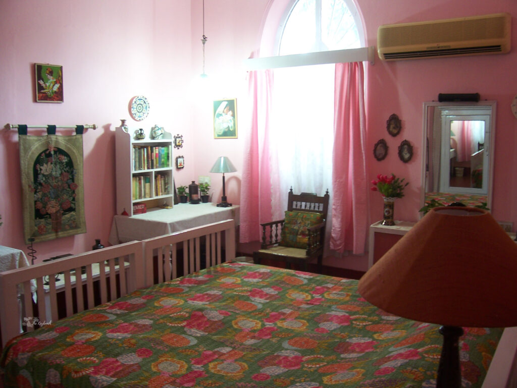The pink bedroom with pretty window curtains and writing tables and dressers | Belmont House in Mangalore, India | TheKeybunch decor blog