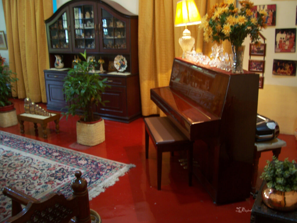 The living room is decorated in a mixed style and a piano in the corner adds that extra bit of old-world charm | Belmont House in Mangalore, India | TheKeybunch decor blog