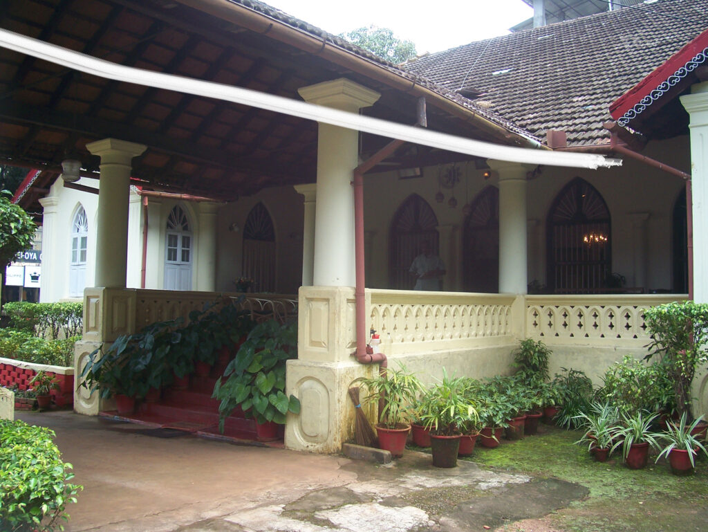 The house has a sloping tiled roof and a capacious verandah | Belmont House in Mangalore, India | TheKeybunch decor blog