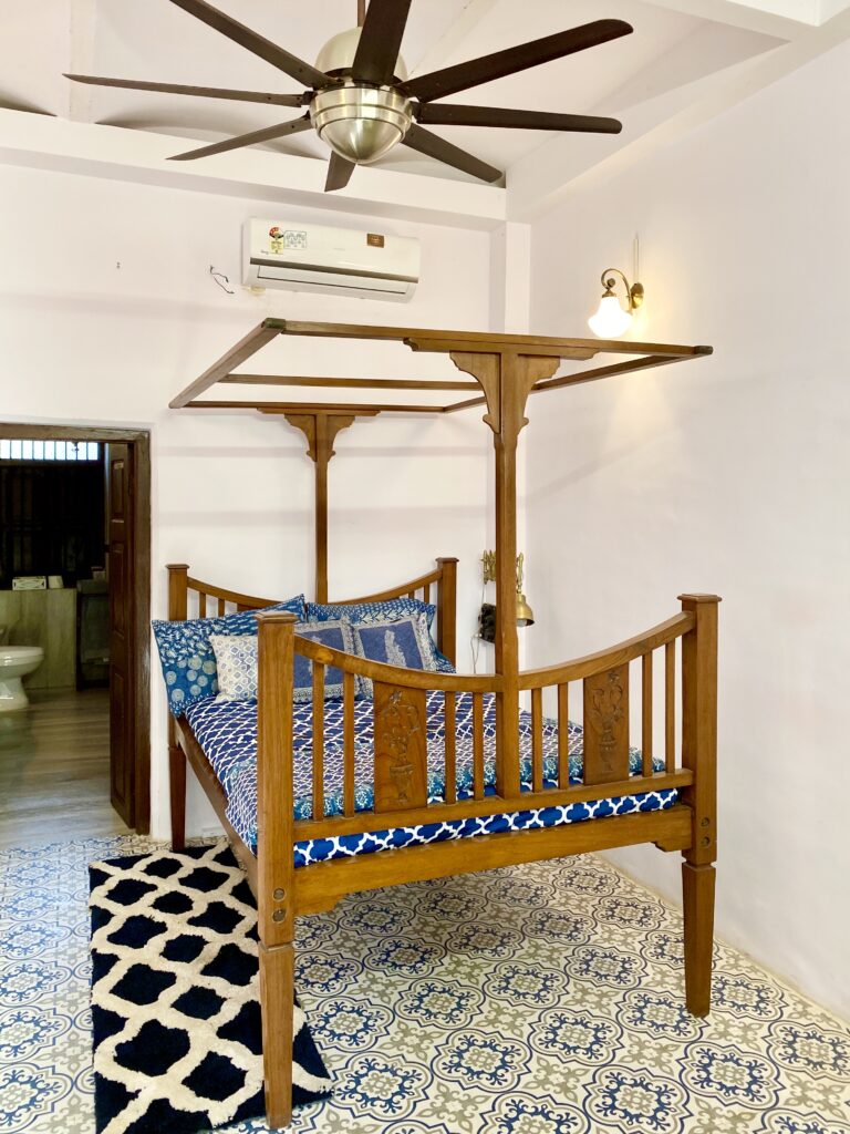 Villa Rashmi - A Heritage Gem in Mumbai | Indian antique bed and handpainted floor tiles at private bedroom | TheKeybunch decor blog