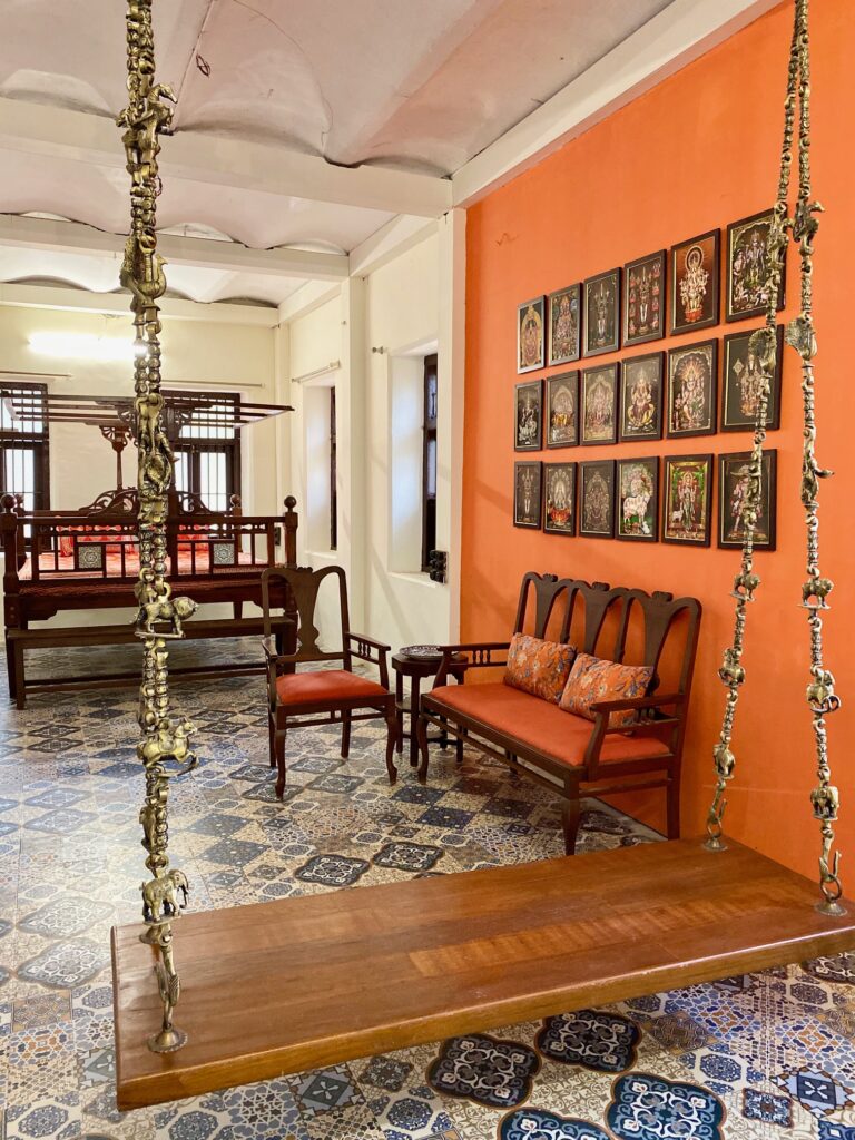 Villa Rashmi - A Heritage Gem in Mumbai | Traditional jhoola swing, antique furniture and wall frames in south indian traditional theme decoration | TheKeybunch decor blog