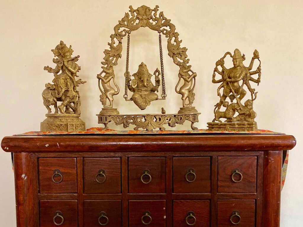 Villa Rashmi - A Heritage Gem in Mumbai | Brass hindu god idols on top of the cabinet | TheKeybunch decor blog