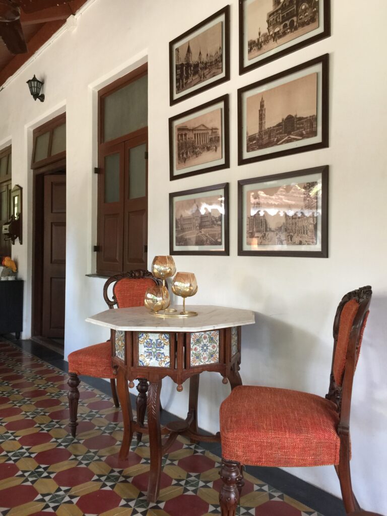 Villa Rashmi - A Heritage Gem in Mumbai | The verandah decorated with wall frames and antique furniture | TheKeybunch decor blog | TheKeybunch decor blog