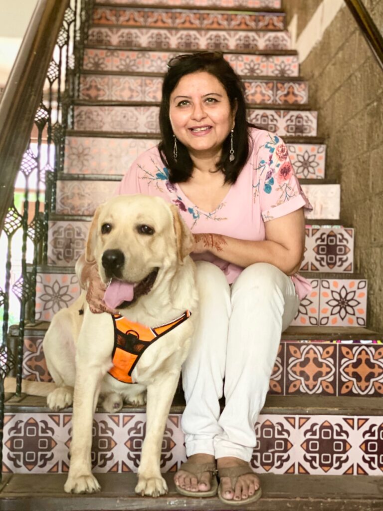 Villa Rashmi - A Heritage Gem in Mumbai | Deval Patel with her dog sitting on stair | TheKeybunch decor blog