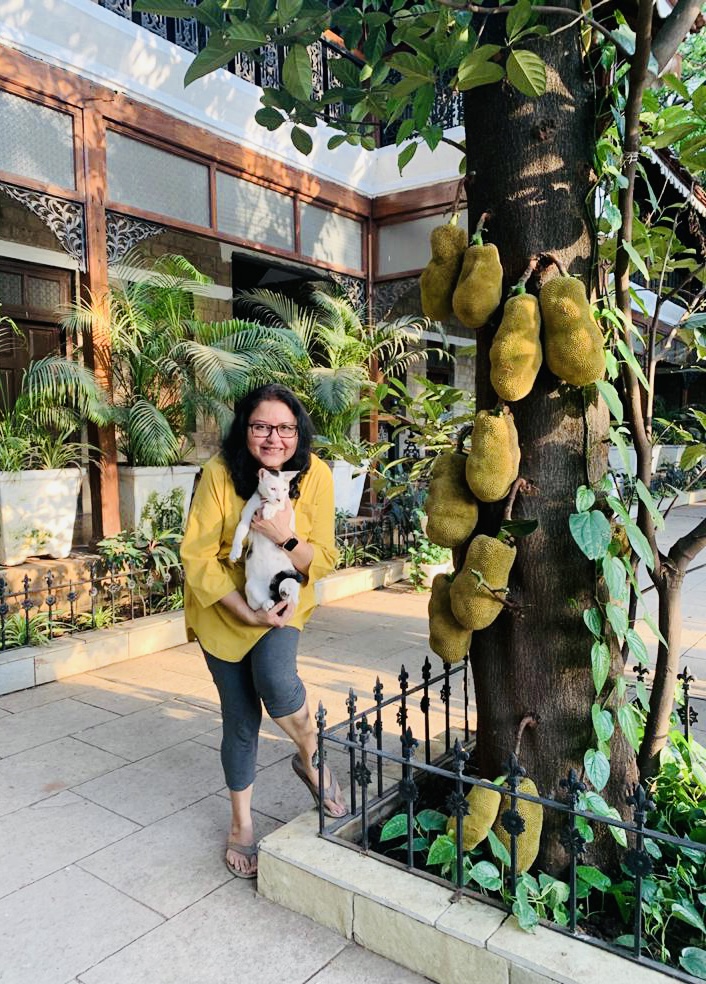 Villa Rashmi - A Heritage Gem in Mumbai | Deval and a cute cat near the jack fruit tree in the garden | TheKeybunch decor blog