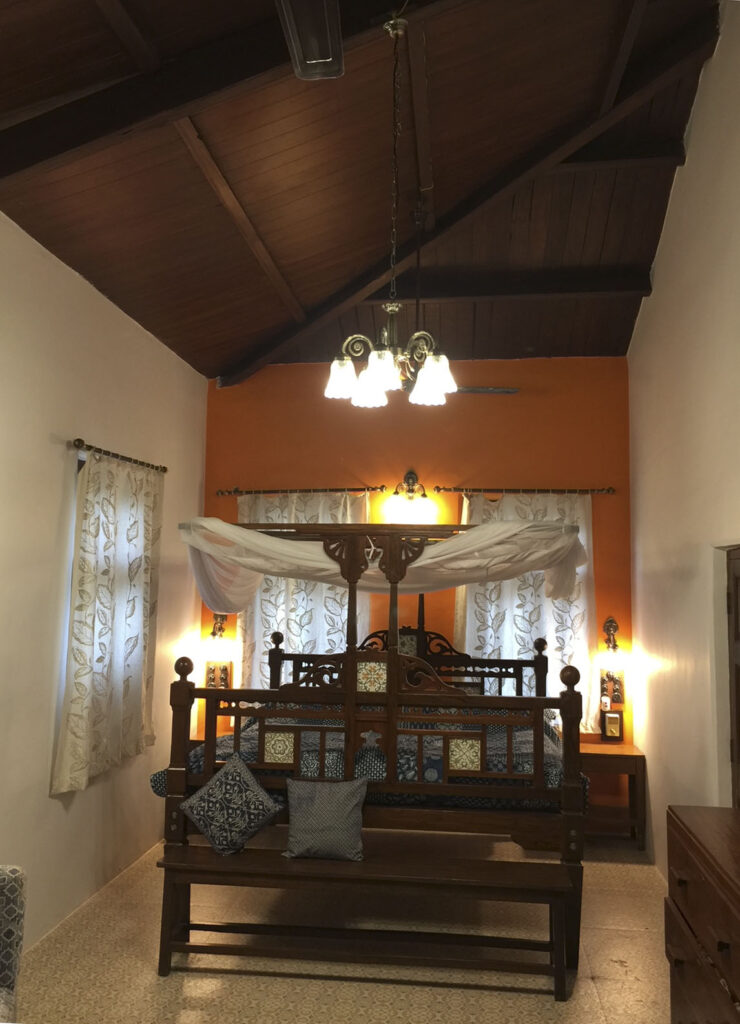 Villa Rashmi - A Heritage Gem in Mumbai | A restored bedroom depicting the lovely wooden sloping cielings at Villa Rashmi | TheKeybunch decor blog
