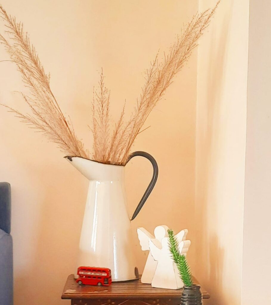 Styling tips | Wooden angels and vase jug at the corner to add interest to the vignette
