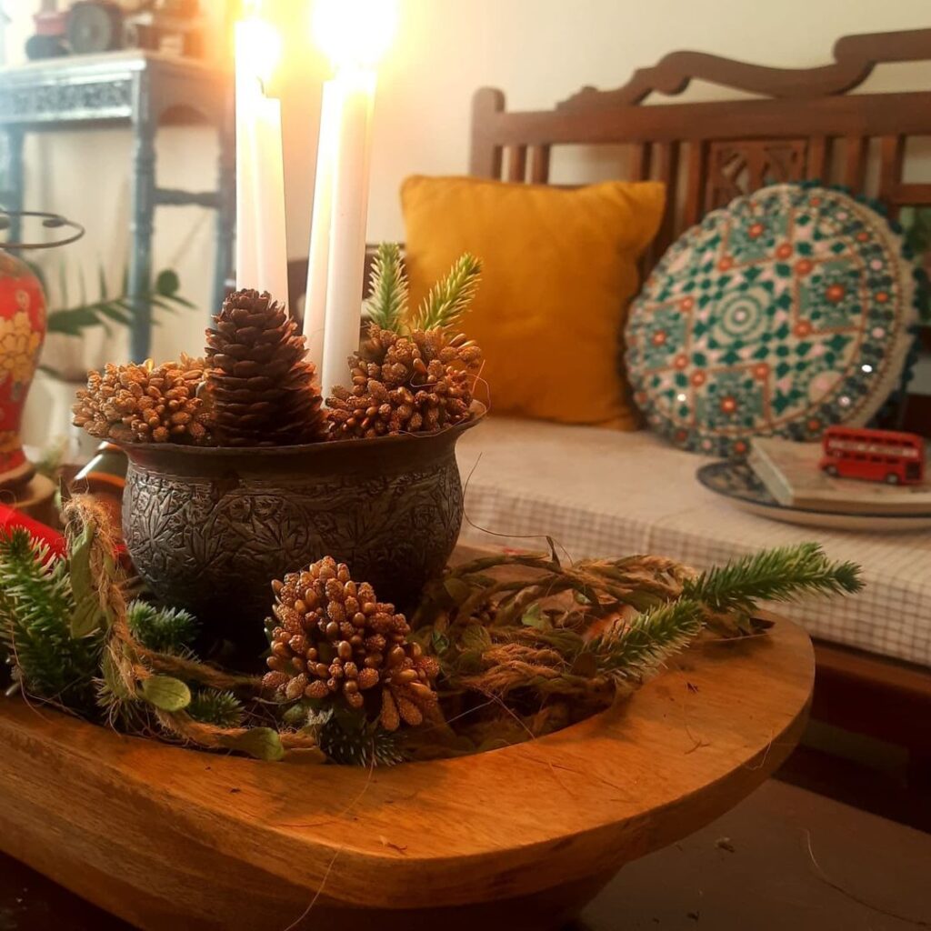 Doughbowls Christmas decor | Doughbowl are filled with old Kashmiri bowl, Vietnamese jar and pine cones