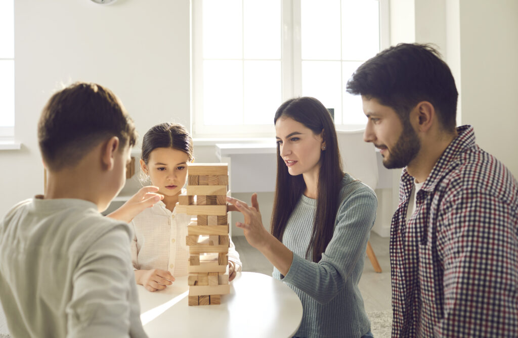 Decor Trends for 2022 | Happy family with children enjoying playing jenga games at home