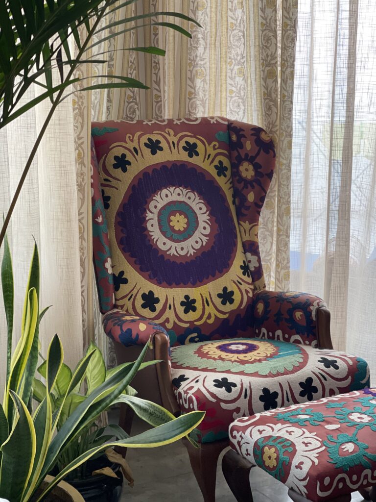 Prameela Nair's Art-Infused Home Abudhabi | Attractive wing chair and table in indian traditional style