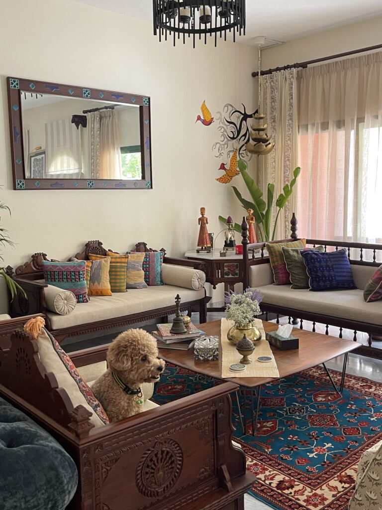 Prameela Nair's Art-Infused Home Abudhabi | Hand painted birds wall art and traditional indian style living room