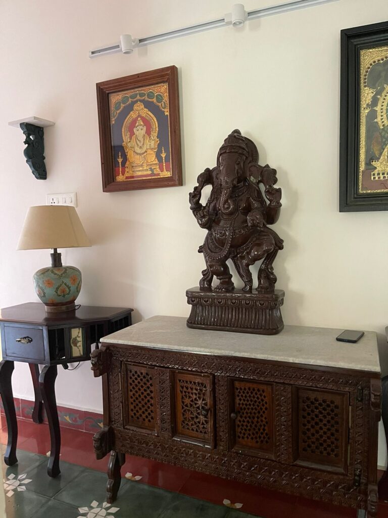 Prameela Nair's Palakkad Home | Prameela collected furniture, artefacts and Tanjore pieces which is absolutely rare fitted on a massive panel in her small living space