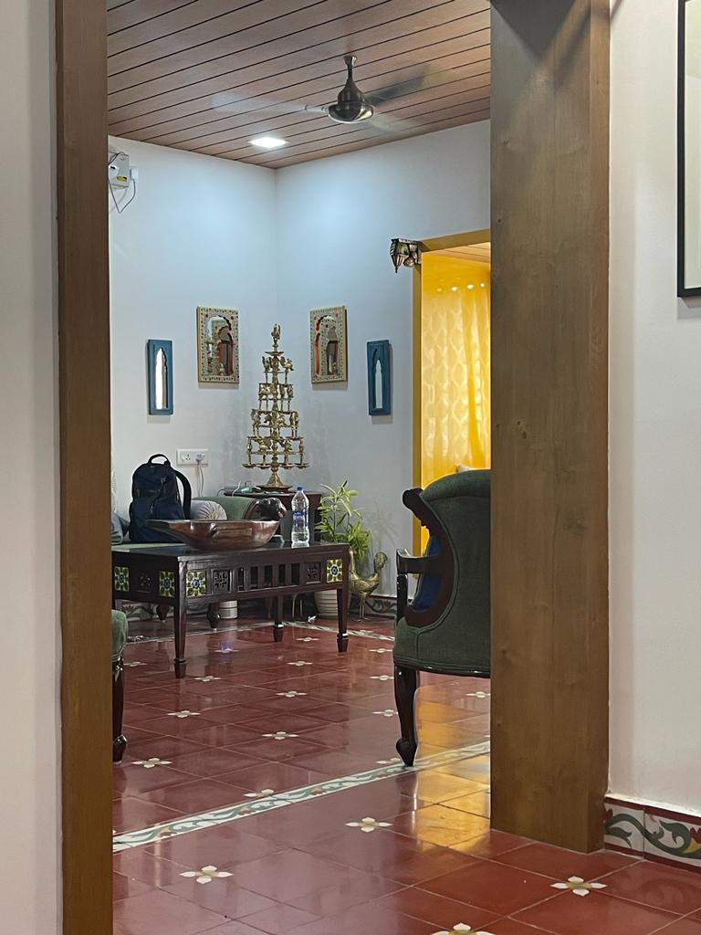 Prameela Nair's Palakkad Home | Brassware, wooden uruli and wooden traditional table display at Prameela living room