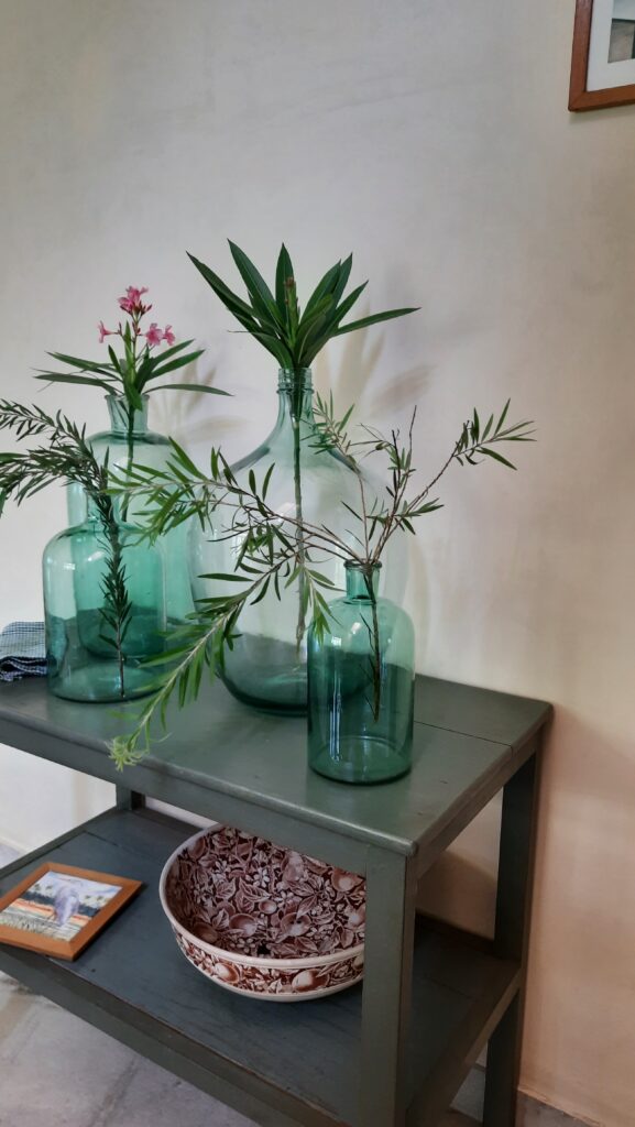 Demijohns in Indian Decor | Arrange demijohn in a cluster with other bottles