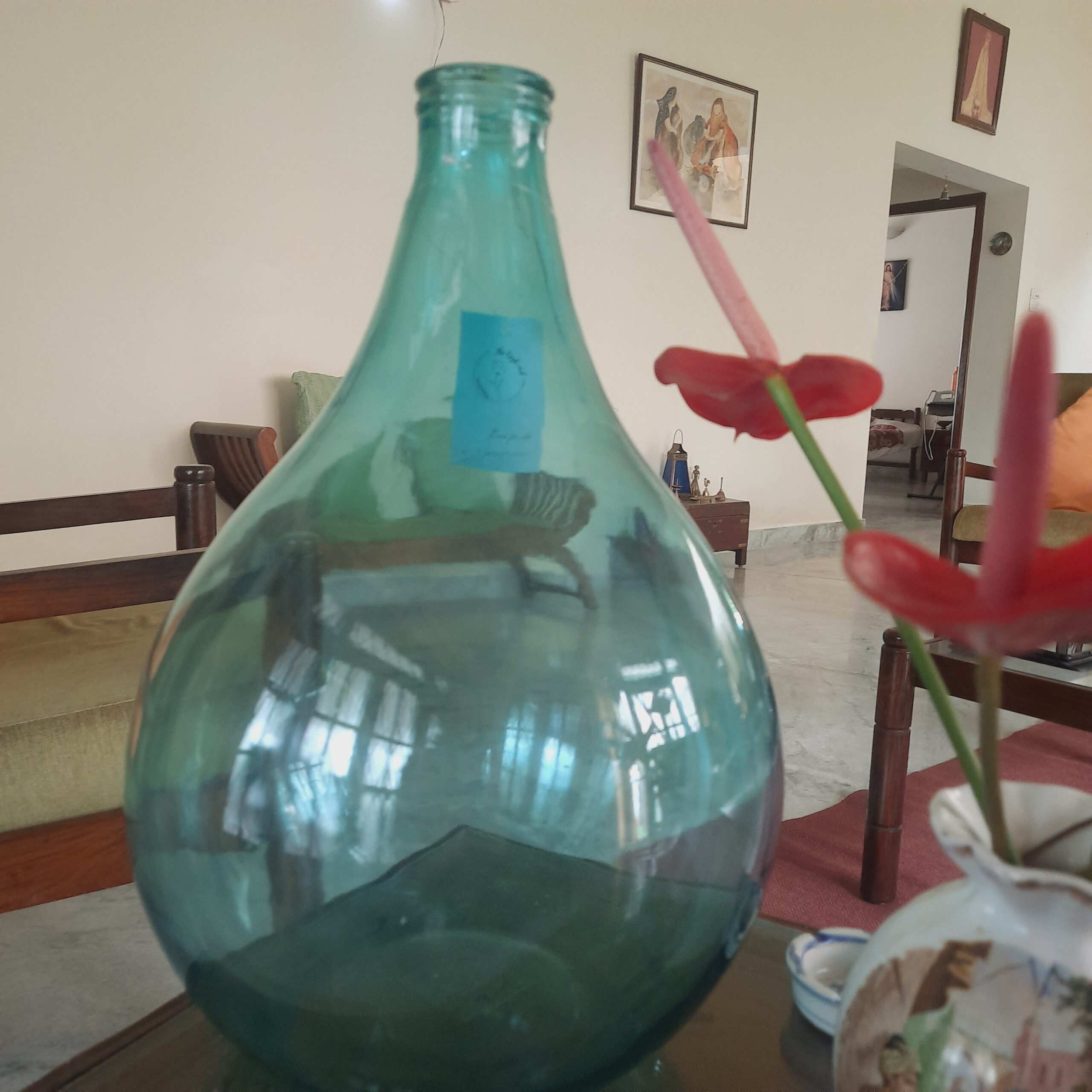 Demijohns in Indian Decor | Blue Demijohn wine bottle at the living room