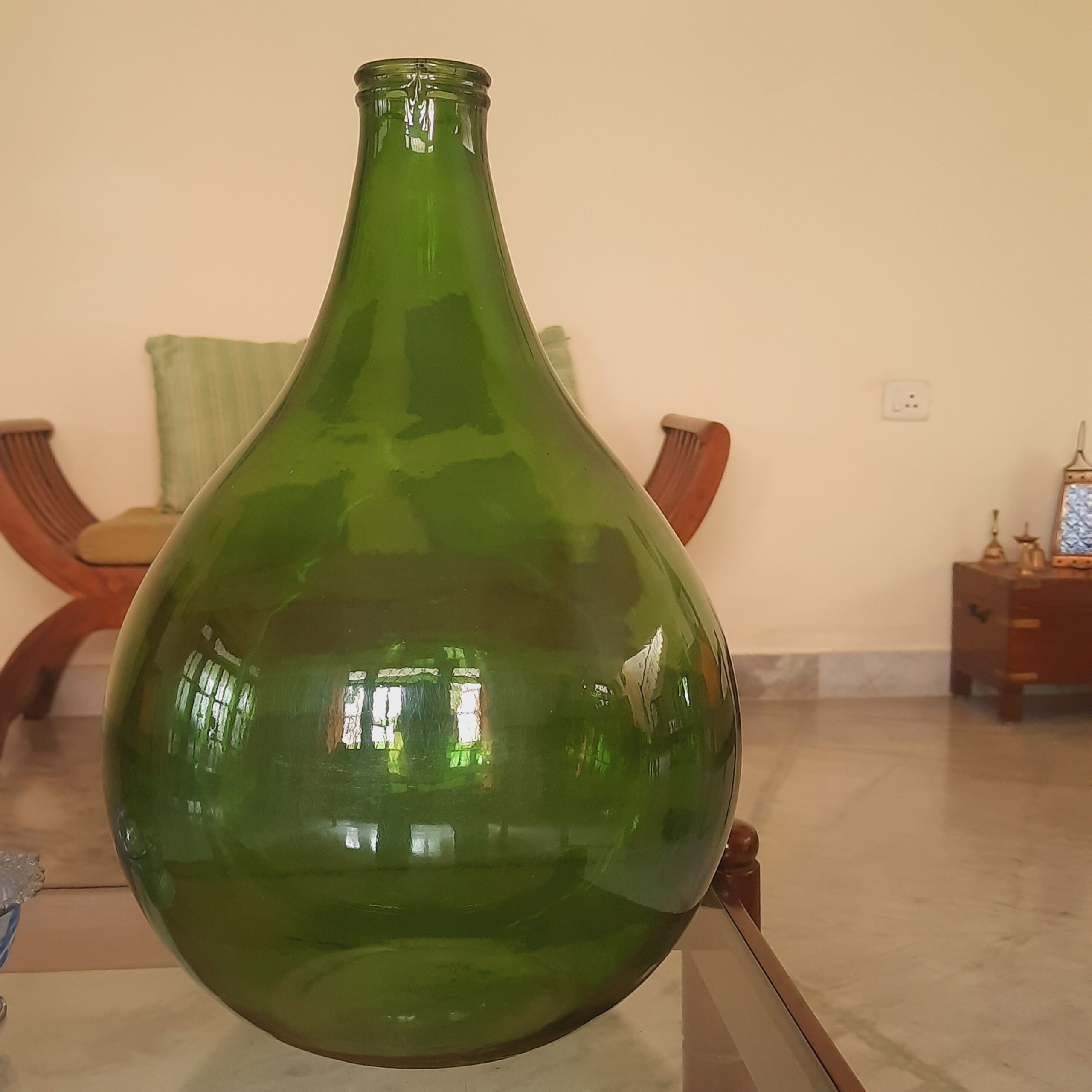 Demijohns in Indian Decor | Green Demijohn wine bottle at the living room
