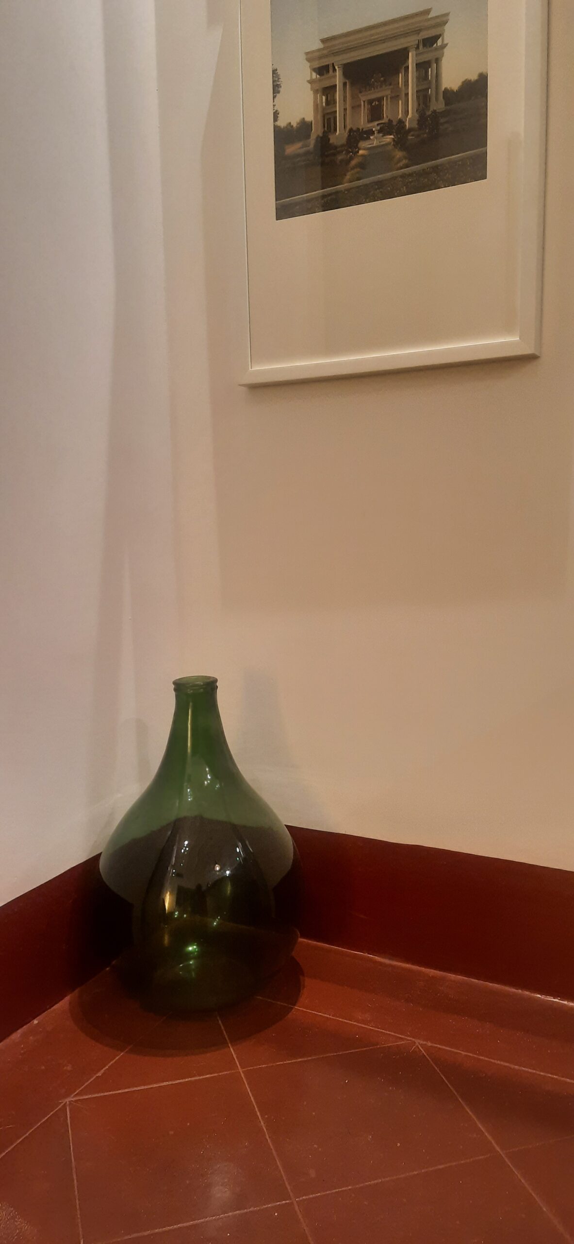 Demijohns in Indian Decor | Vintage large green demijohn at the corner of the room