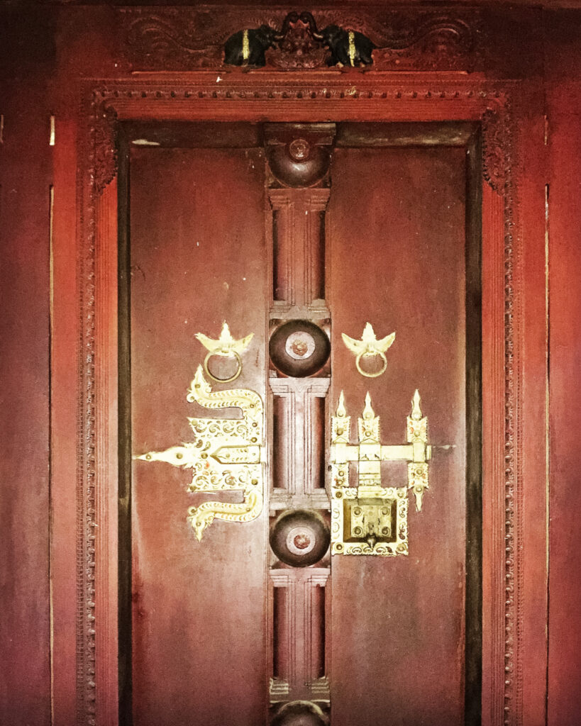 Old Traditional Kerala Home, Revived by Benny Kuriakose | The ‘Manichitrathazhu’ and ‘Irumpudhal’ of doors were polished and restored. Brass knobs add contrast to the flow of the timber carvings