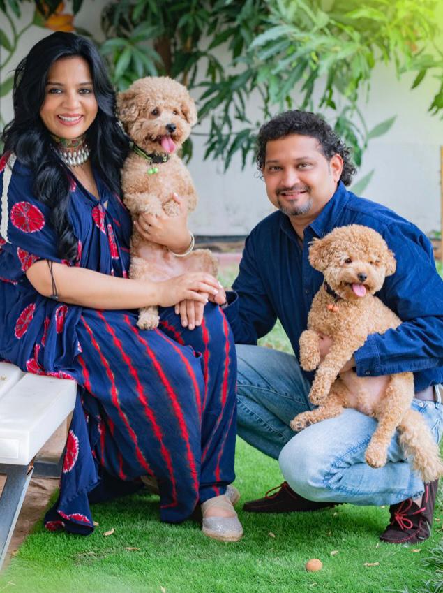 Prameela Nair's Art-Infused Home Abudhabi | Prameela Nair with her husband Rahul and her two fur babies Simba and Scooby