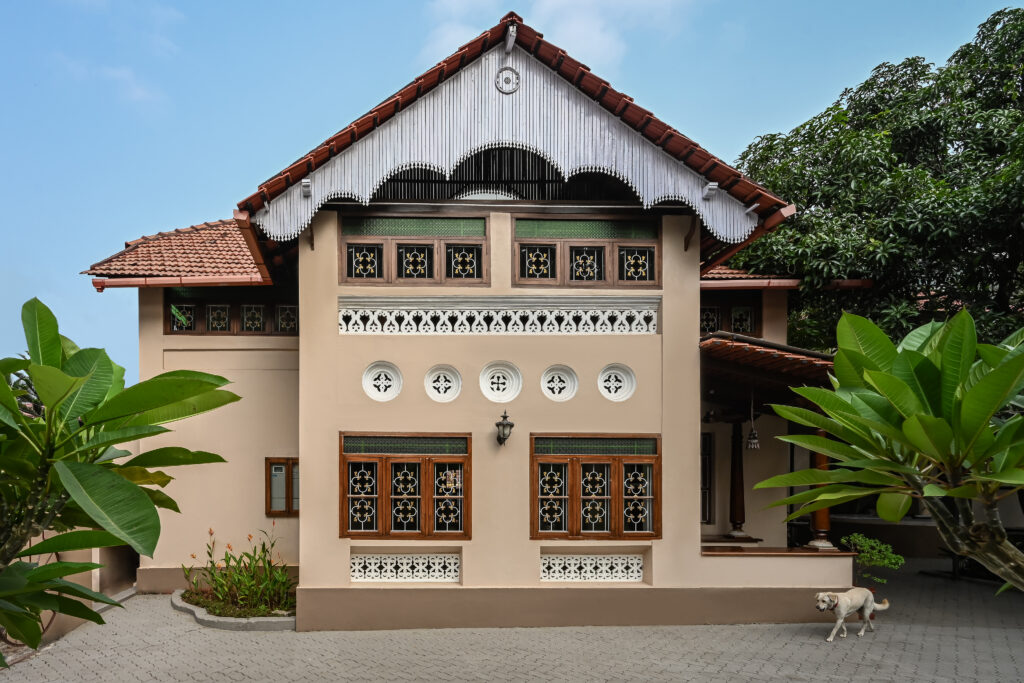 Raja’s Cottage - A traditional Mangalore home with a Chettinad Flavour | front facade | dog in picture