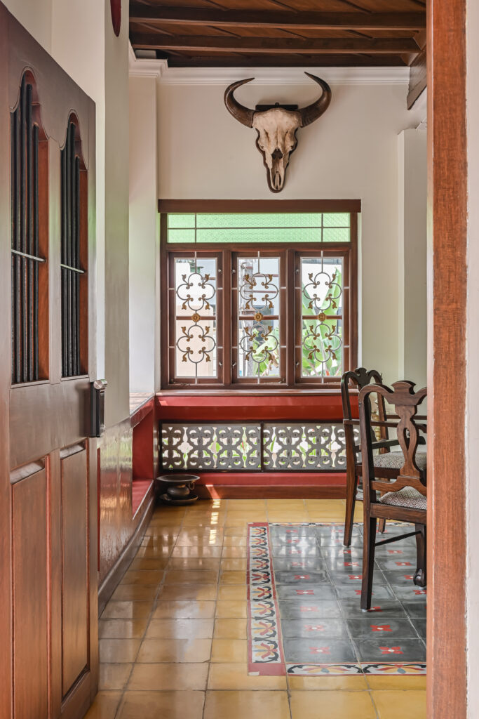 Raja’s Cottage - A traditional Mangalore home with a Chettinad Flavour | chettinad tiles and a bison head on the wall